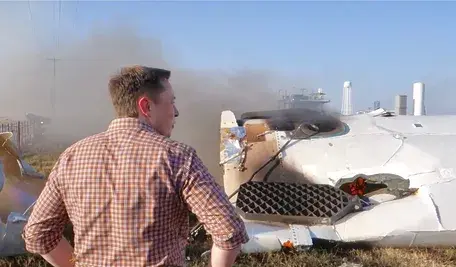 Elon_Musk_overlooking_the_remains_of_F9R_(36411051713) (1).webp