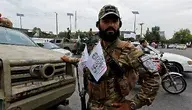 1280px-Taliban_member_with_chest_flags.webp