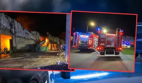 Strażacy gaszą pożar w Zakładzie Utylizacji Odpadów w Elblągu przy ul. Mazurskiej – gęsty dym unosi się nad halą sortowni.