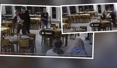 Stopklatka z zapisu monitoringu przedstawiającego nagranie z lokalu gastronomicznego w Dusznikach Zdroju, na którym widać moment szarpaniny między nowo wybraną burmistrz a miejskim radnym. Obie osoby są widoczne podczas kłótni, a w tle widać fragment wnętrza restauracji.