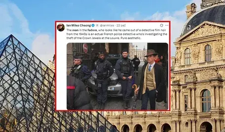 Elegancko ubrany 15-letni Pedro Elias Garzon Delvaux w kapeluszu i z parasolką, sfotografowany przed Luwrem w dniu kradzieży klejnotów Napoleona – zdjęcie Thibaulta Camusa z Associated Press