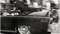 Clint_Hill_on_the_limousine.webp