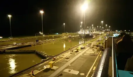 panama-canal-Miraflores-lock-night-boat-ship-travel-commerce-world-waterway-reflection-water-light-metropolitan-area-lighting-street-light-city-even.webp
