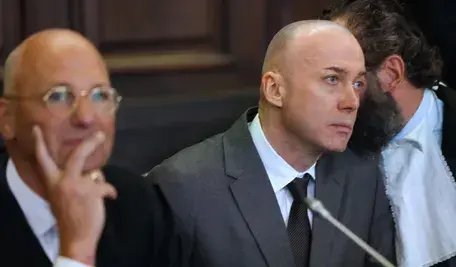 Serhii Kuznietsov (C), a former Ukrainian army officer, attends a trial at the Hanseatic Higher Regional Court in Hamburg, Germany, 14 October 2026. A trial is set to begin against a defendant who, according to the Federal Prosecutor General, is alleged to have been a member of a group that planted explosive devices on the Nord Stream 1 and Nord Stream 2 pipelines near the Danish island of Bornholm in September 2022.