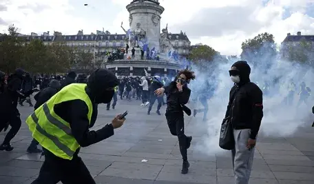 Protesters face police forces during a demonstration against the rising cost of living and cuts to public services at the Republic square in Paris, France, 17 October 2026. A nationwide mobilization brings together Yellow Vest 'Gilets Jaunes' activists, high school and university students, trade unions and other groups in a convergence of protests over the rising cost of living, fuel prices and deteriorating public services, as well as calling for better education and school conditions