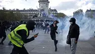 Protesters face police forces during a demonstration against the rising cost of living and cuts to public services at the Republic square in Paris, France, 17 October 2026. A nationwide mobilization brings together Yellow Vest 'Gilets Jaunes' activists, high school and university students, trade unions and other groups in a convergence of protests over the rising cost of living, fuel prices and deteriorating public services, as well as calling for better education and school conditions