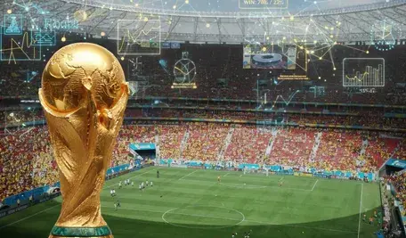 Złoty puchar na tle stadionu piłkarskiego