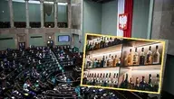 Zdjęcie butelek alkoholu na tle sali plenarnej 