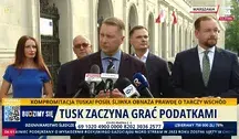 Przemysław Czarnek podczas konferencji prasowej obok niego w niebieskiej sukience Edyta MARCHELSKA-GROSZFELD