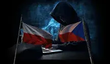 Flagi Polski i Czech na tle mężczyzny siedzącego przy komputerze