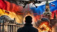 Symboliczna grafika przedstawiająca drona bojowego nad mapą Europy pomiędzy flagą Niemiec i Rosji. W tle widoczne są budynki Berlina i Kremla, eksplozja, dym oraz celownik sugerujący zagrożenie, sabotaż i eskalację wojny hybrydowej.